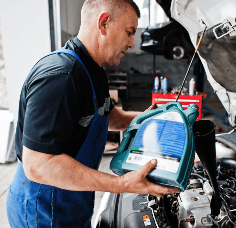 car-repair-maintenance-theme-mechanic-uniform-working-auto-service-pouring-new-motor-oil 1